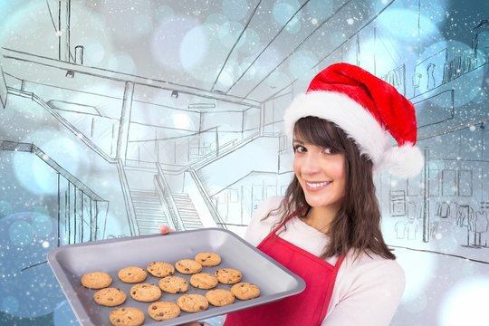 Composite image of brunette in santa hat offering hot cookies