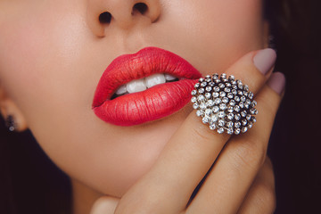 Red Lips with Diamond Jewelry. Fashion Make-up and Cosmetics