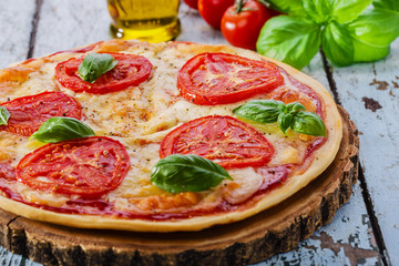 pizza with mozzarella and tomatoes