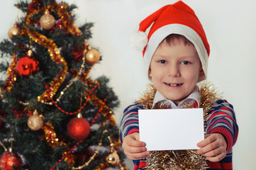 boy holding greeting card. Christmastime