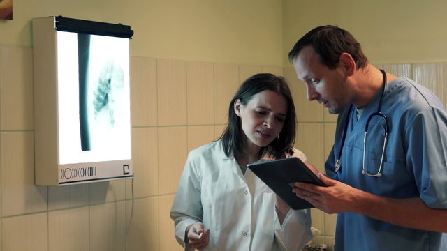 Doctors fighting during checking results of lungs examination in