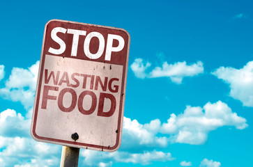 Stop Wasting Food sign with sky background