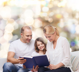 Fototapeta na wymiar happy family with book at home