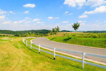 Obraz premium Road to golf playing area in Paczultowice village, Poland