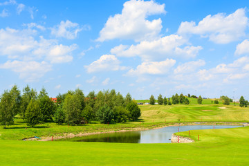 Golf course green play area on sunny summer day, Poland