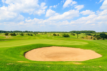 Golf course green play area on sunny summer day, Poland