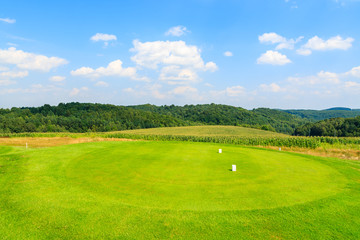 Golf course green play area on sunny summer day, Poland