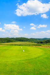 Golf course green play area on sunny summer day, Poland