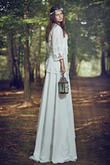 Fototapeta premium Fairy woman portrait in a forest