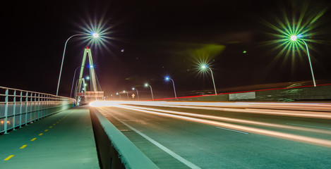 Fototapeta na wymiar traffic commute on bridge at night long exposure
