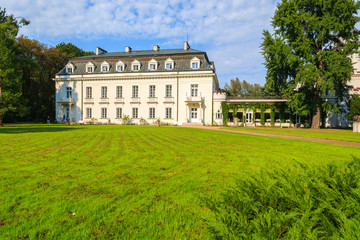 Fototapeta na wymiar Beautiful palace in green park of Radziejowice village, Poland