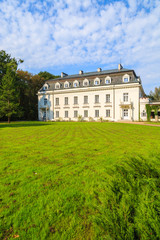 Fototapeta na wymiar Beautiful palace in green park of Radziejowice village, Poland