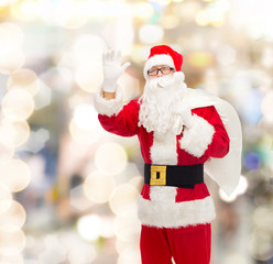 man in costume of santa claus with bag