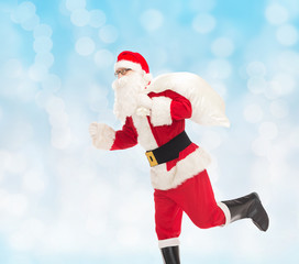 man in costume of santa claus with bag