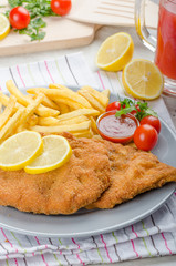 Schnitzel with french fries and a spicy dip