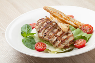 Gourmet caesar salad with grilled meat fillet, cherry tomatoes,