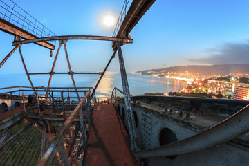 Metal construction at night city landscape