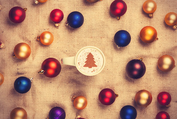 cappuccino and with red, blue and gold christmas balls