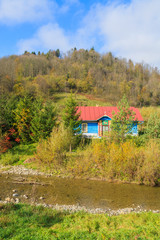 Traditional house in Beskid Niski Mountains in autumn, Poland