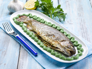 trout with spinach cream decoration