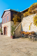 Naklejka na ściany i meble Traditional house in Tomaszowice village park in autumn, Poland