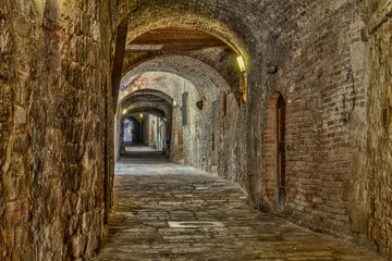 Fototapeta na wymiar covered alley in Colle di Val d'Elsa, Tuscany, Italy