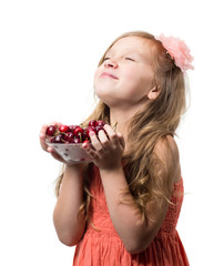 Little girl with cherries