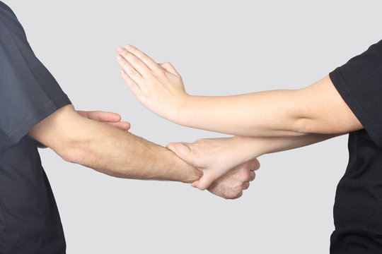 Athletes are performing techniques of Wing Chun