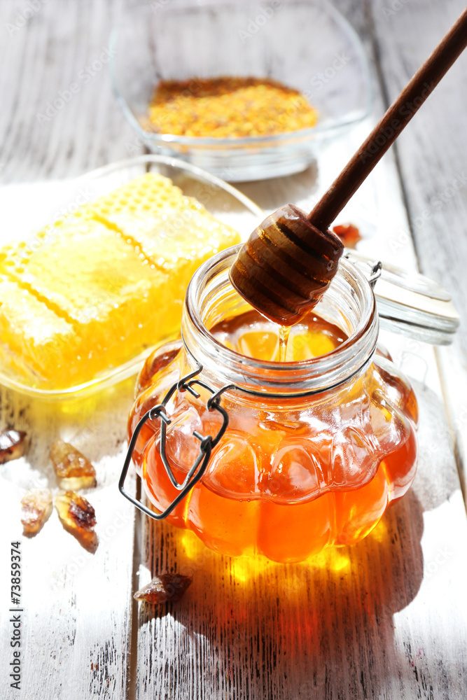 Poster fresh honey on wooden table