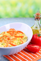 Casserole with vegetables in bowl  on natural background