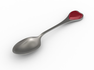 Silver spoon with heart emblem on handle