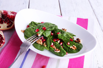 Fresh salad with greens, garnet and spices