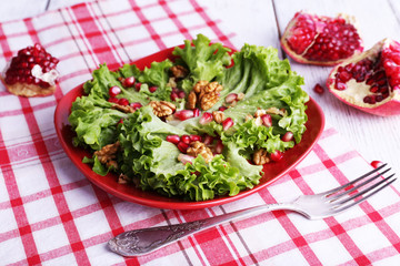 Fresh salad with greens, garnet and spices