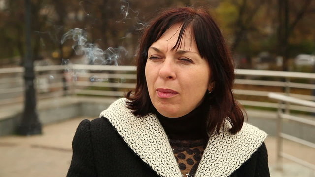 woman smokes a cigarette 2