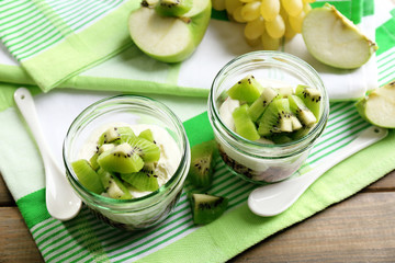 Healthy dessert with muesli and fruits on table