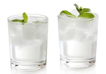 Glasses with ice cubes isolated on white