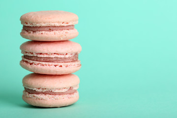 Gentle colorful macaroons on color background