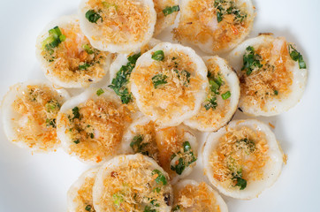 Vietnamese mini rice pan cakes garnished with shredded dried shr