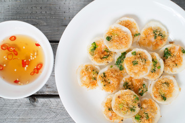 Vietnamese mini rice pan cakes garnished with shredded dried shr