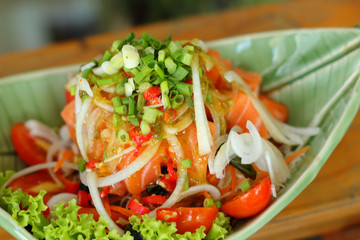 Fresh salmon salad with spices - Japanese food.