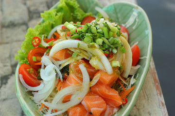 Fresh salmon salad with spices - Japanese food.