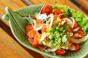 Fresh salmon salad with spices - Japanese food.