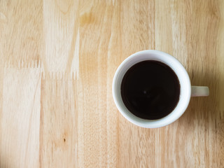 Cup of coffee in wood table