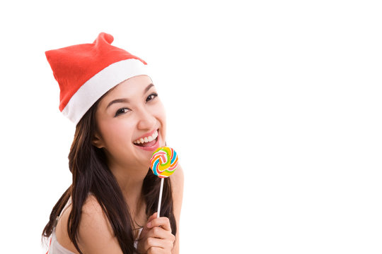 happy smile girl wearing a santa suit holding a candy for christ