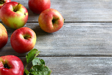 Fresh apples on wooden boards