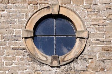 Round window in a stone frame © Arena Photo UK