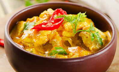 Chicken curry with  parsley in  bowl