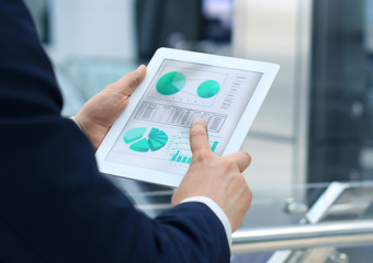 Business person analyzing financial statistics