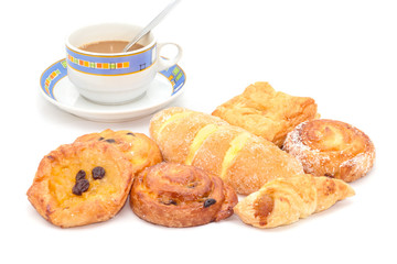 Variety of bread with coffee on white background