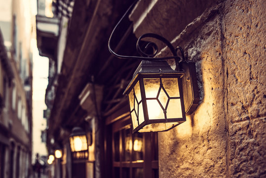 Line of lanterns in Venice at night on the vintage wall